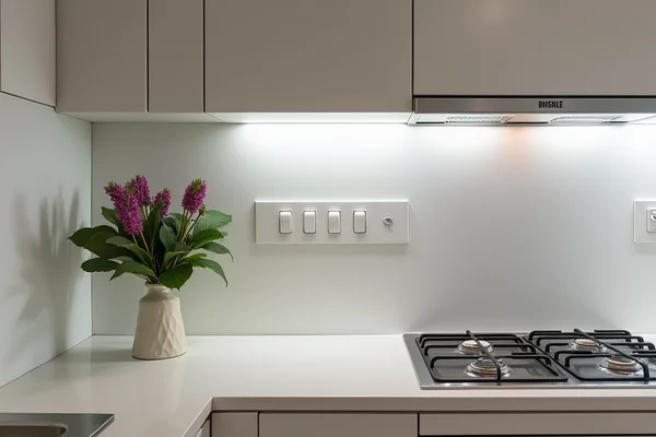 Modern kitchen with multiple electrical outlets and smart appliances