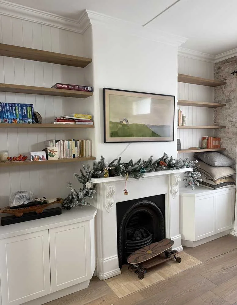 Heritage living room restoration with custom built-in shelving, VJ panelling and restored Victorian fireplace by MTS Group