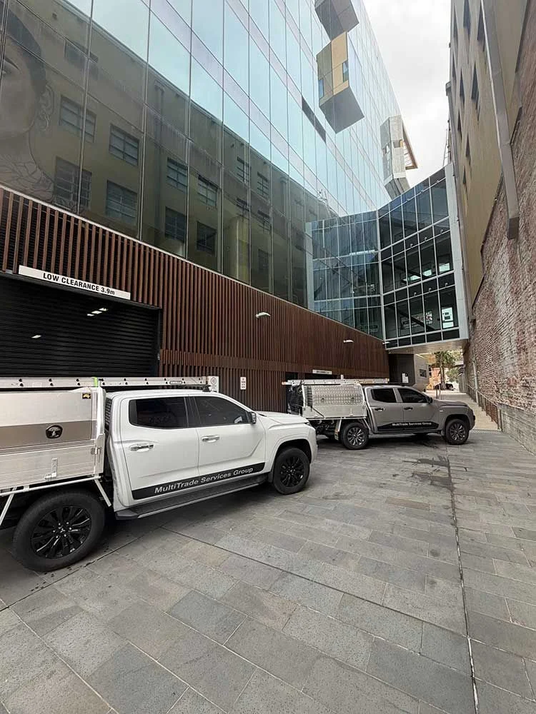MTS Group branded service vehicles at a commercial building site