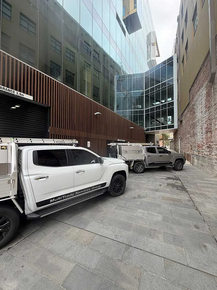 MultiTrade Services Group work vehicles at commercial property maintenance job